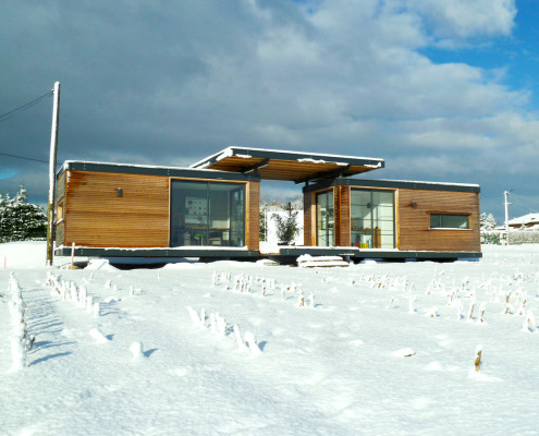 Maison en bois Iroko Evolutiv sous la neige