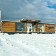 Maison en bois Iroko Evolutiv sous la neige